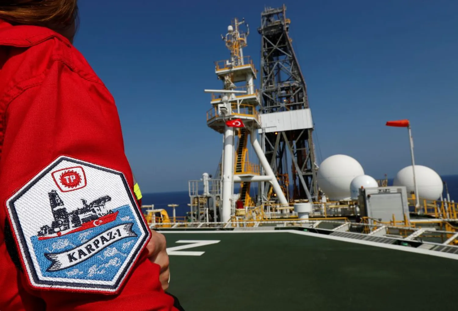 A Turkish Petroleum (TPAO) engineer poses on the helipad of Turkish drilling vessel Yavuz in the eastern Mediterranean Sea off Cyprus, August 6, 2019. (Reuters)