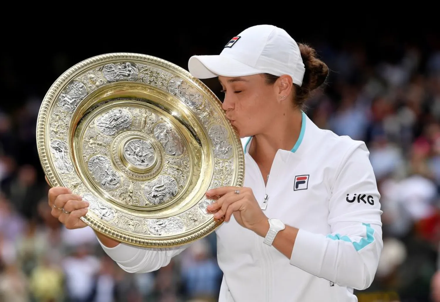 Tennis - Wimbledon - All England Lawn Tennis and Croquet Club, London, Britain - July 10, 2021 Australia's Ashleigh Barty holds the trophy after winning her final match against Czech Republic's Karolina Pliskova REUTERS/Toby Melville
