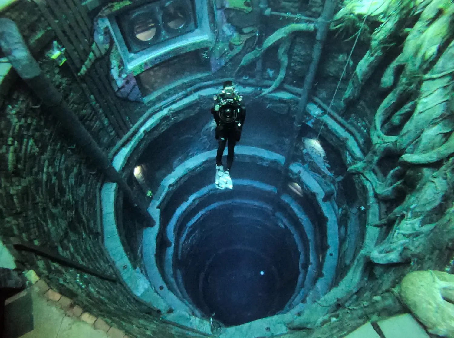 A diver experiences Deep Dive Dubai, the deepest swimming pool in the world reaching 60m, in the United Arab Emirates, on July 10, 2021. (AFP)