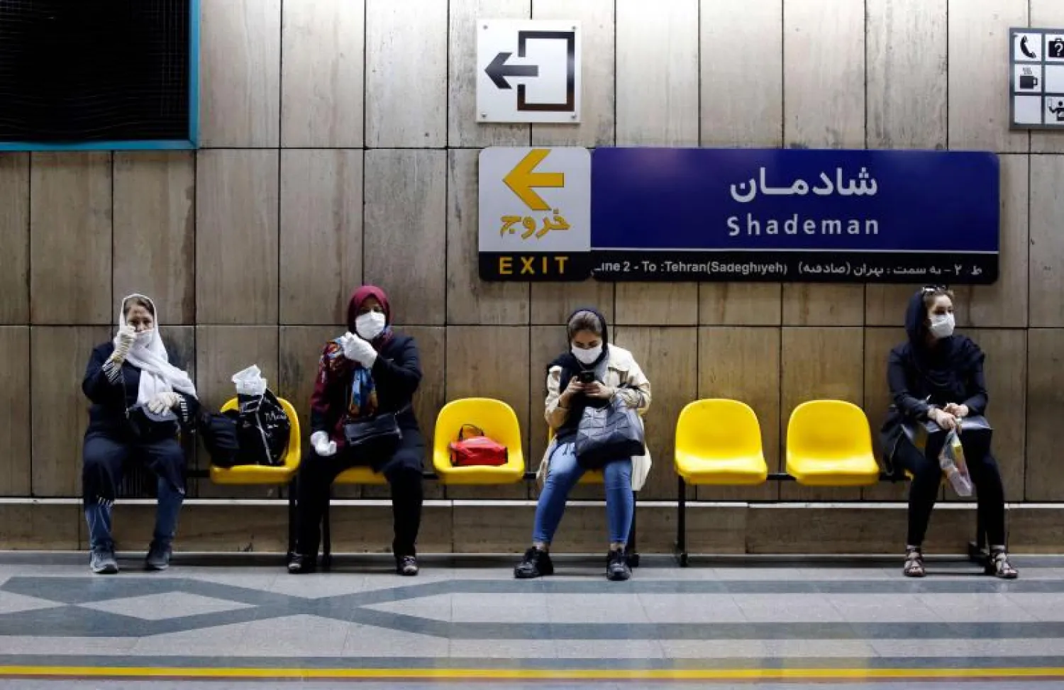 Iranian women wait for a train in a subway station in the capital Tehran. (AFP)