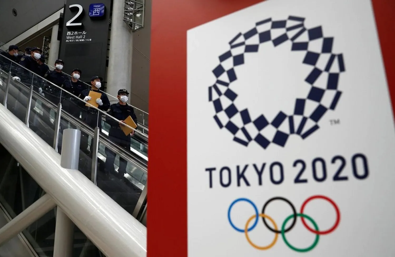 Police officers conduct a security sweep of the Tokyo Olympic Main Press Center in Tokyo, Japan on Jul 12, 2021. (Reuters)