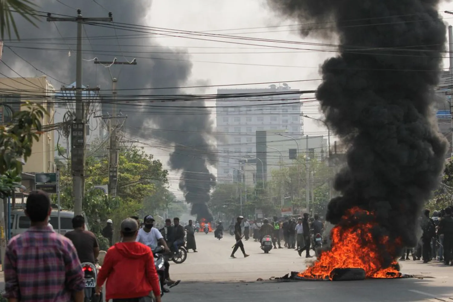 Tires burn on a street as protests against the military coup continue, in Mandalay, Myanmar March 27, 2021. (Reuters)