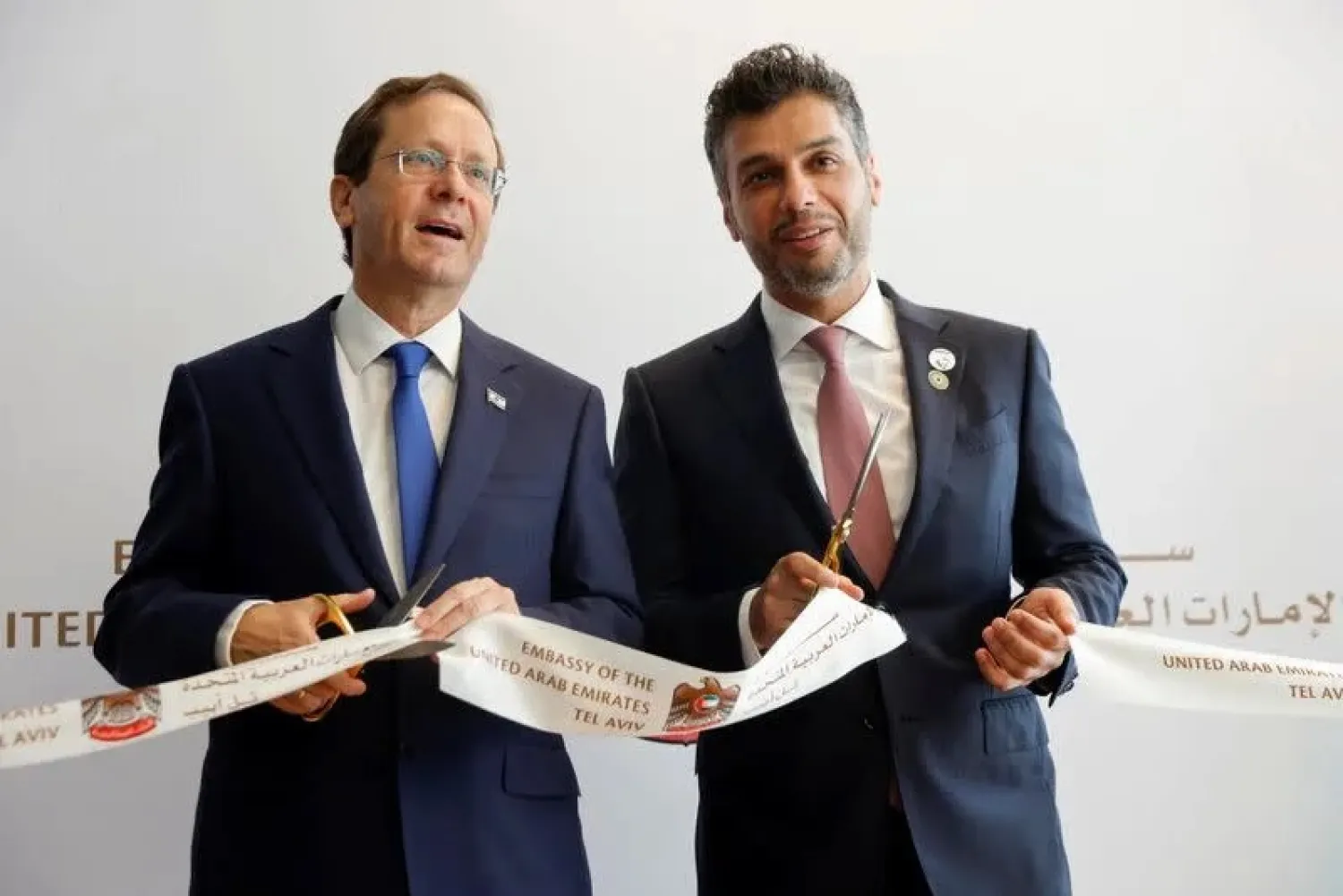 UAE Ambassador to Israel, Mohamed Al Khaja, and Israeli President Isaac Herzog cut a ribbon during the opening ceremony of the Emirati embassy in Tel Aviv, Israel July 14, 2021. (Reuters)