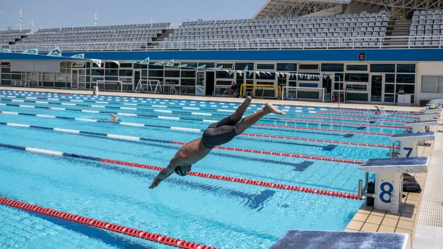 Syrian refugee Ibrahim al-Hussein, an amputee swimmer who lost his leg during the war in Syria, dives during a training at the Olympic Aquatic Centre, in Athens, on Wednesday , June 30, 2021. Ibrahim al-Hussein will be part of a Refugee Paralympic Team for the Tokyo 2020 Paralympic Games as the International Paralympic Committee announce Wednesday. (AP Photo/Petros Giannakouris)

