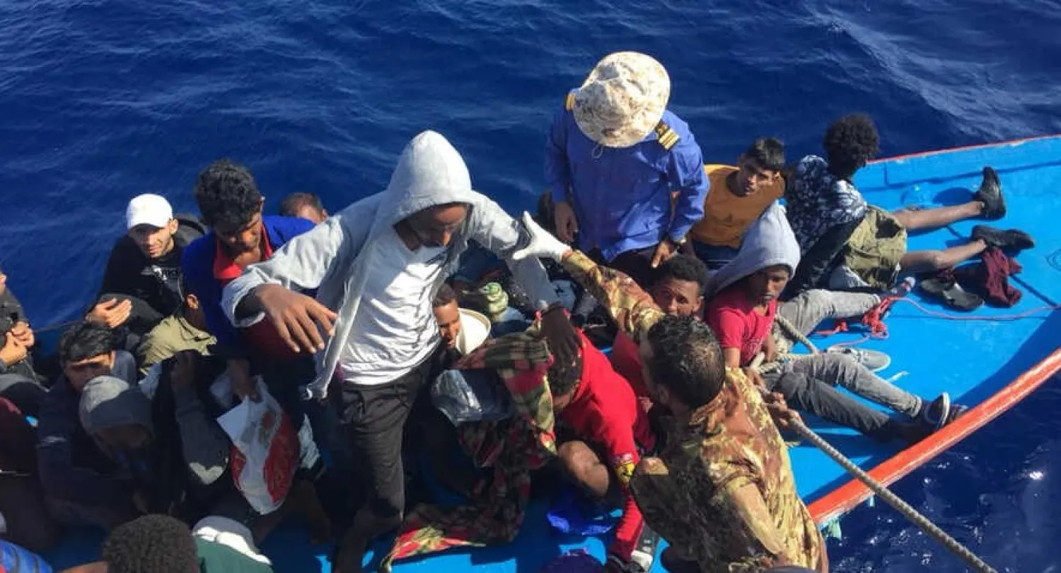 FILE - Migrants in a dinghy are rescued by the Libyan coast guard in the Mediterranean Sea off the coast of Libya, Oct. 18, 2019. Reuters
