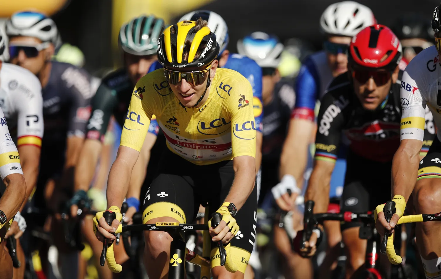 Cycling - Tour de France - Stage 21 - Chatou to Paris Champs-Elysees - France - July 18, 2021 UAE Team Emirates rider Tadej Pogacar of Slovenia wearing the yellow jersey in action during stage 21 Pool via REUTERS/Benoit Tessier