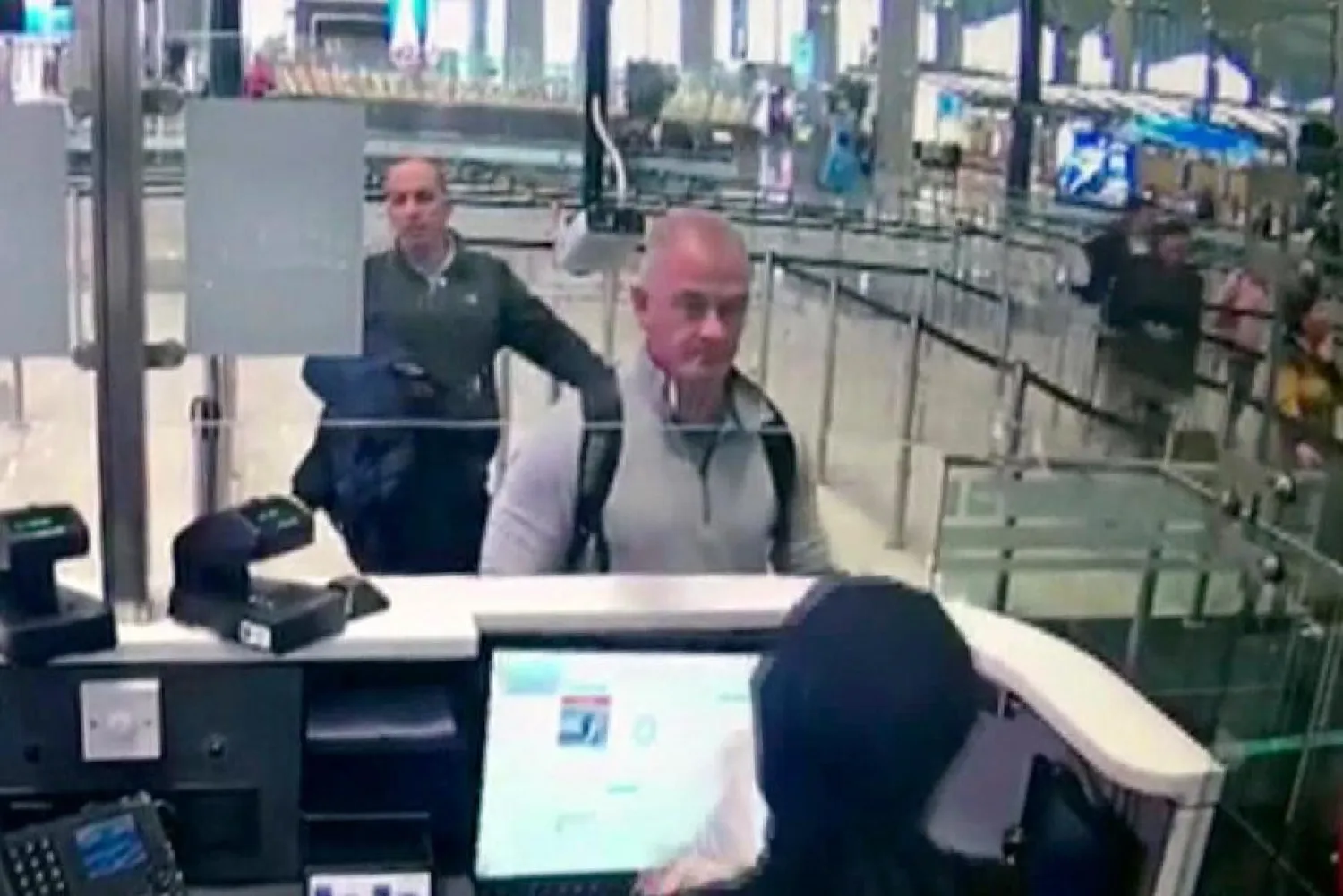 This Dec. 30, 2019, image from security camera video shows Michael L. Taylor, center, and George-Antoine Zayek at passport control at Istanbul Airport in Turkey. (AP)
