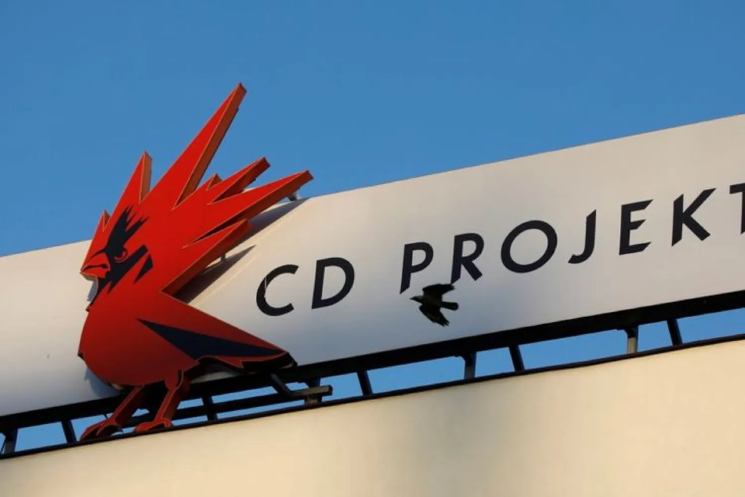 A bird flies in front of the Cd Projekt logo at its headquarters in Warsaw, Poland January 21, 2020. (Reuters)