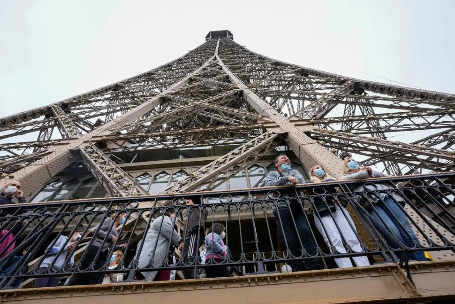 Visitors enjoy the view from the Eiffel Tower in Paris, Friday, July 16, 2021. The Eiffel Tower is reopening Friday for the first time in nine months, just as France faces new virus rules aimed at taming the fast-spreading delta variant. AP