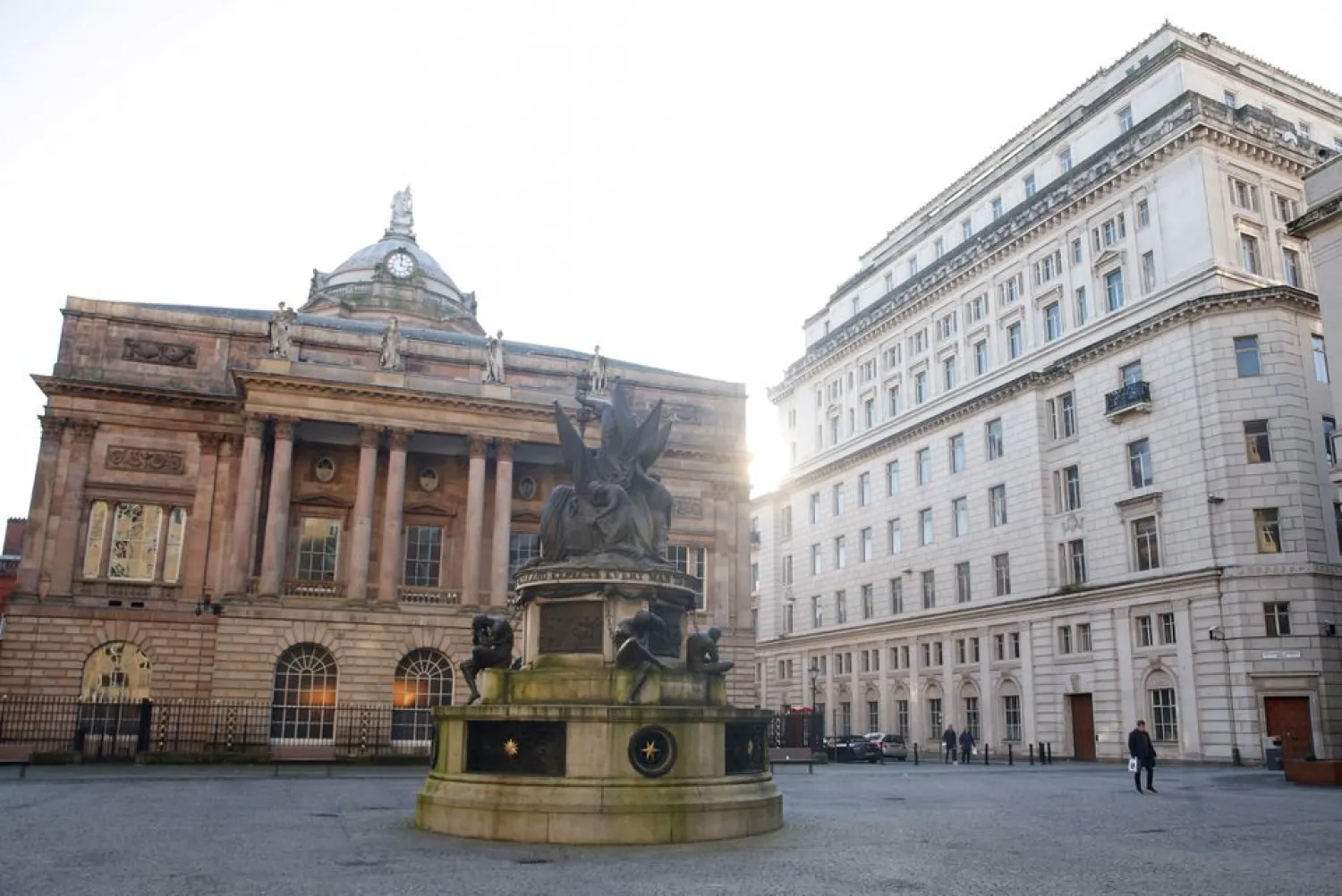 People walk on a deserted square, amid the coronavirus disease (COVID-19) outbreak, in Liverpool, Britain, January 5, 2021. REUTERS/Phil Noble


