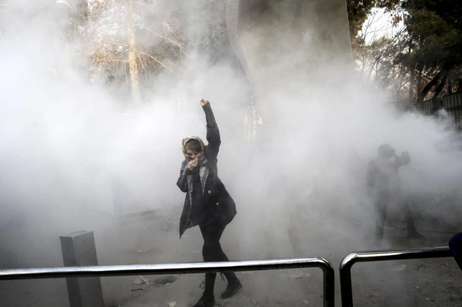 FILE -  Protest seen inside Tehran University while a smoke grenade is thrown by anti-riot Iranian police, in Tehran, Iran. AP
