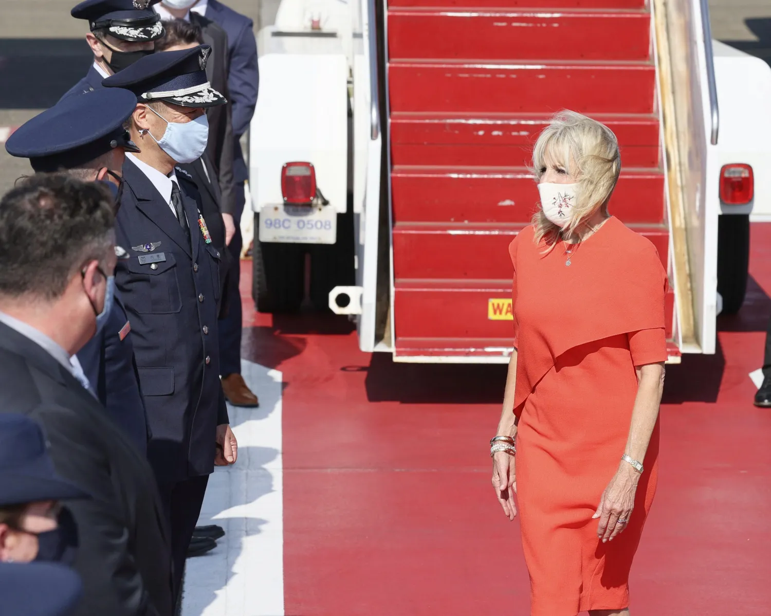 US First Lady Jill Biden is greeted by Japanese and US delegates upon her arrival at Yokota Air Base for attending the opening ceremony of the Tokyo 2020 Olympic Games in Tokyo July 22, 2021, Japan, in this photo released by Kyodo. Kyodo/via REUTERS