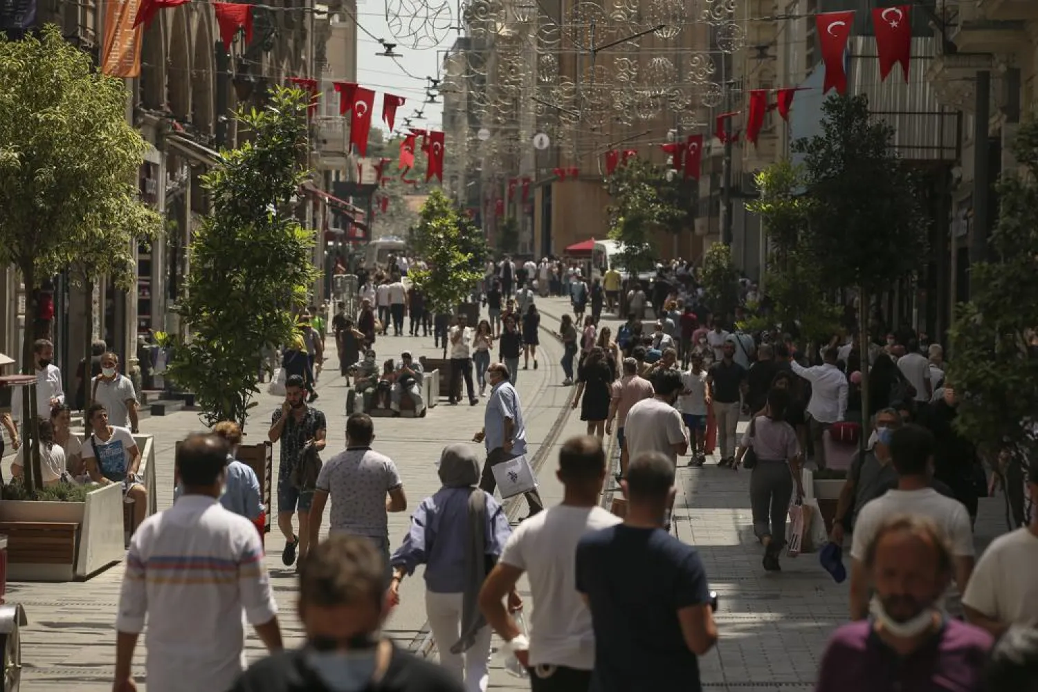People walk on Istiklal Street, the main shopping street in Istanbul, Thursday, July 1, 2021. (AP)