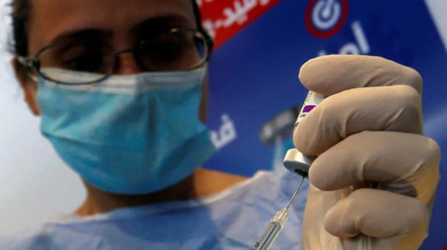 A nurse prepares a dose of the AstraZeneca vaccine at a vaccination center in Cairo. (Reuters)