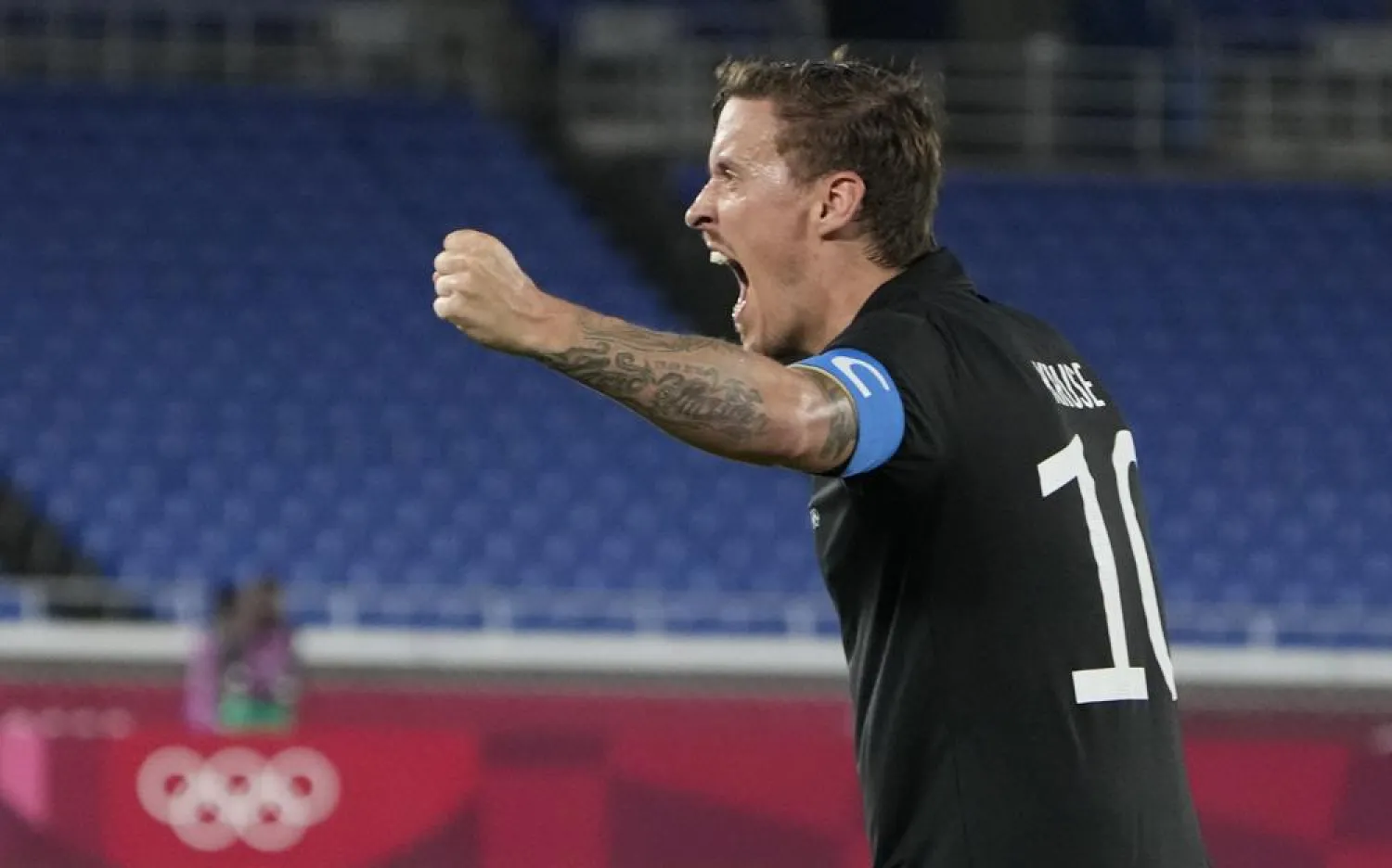 Germany’s Max Kruse celebrates a goal scored by teammate Felix Uduokhai during the match. (AP)