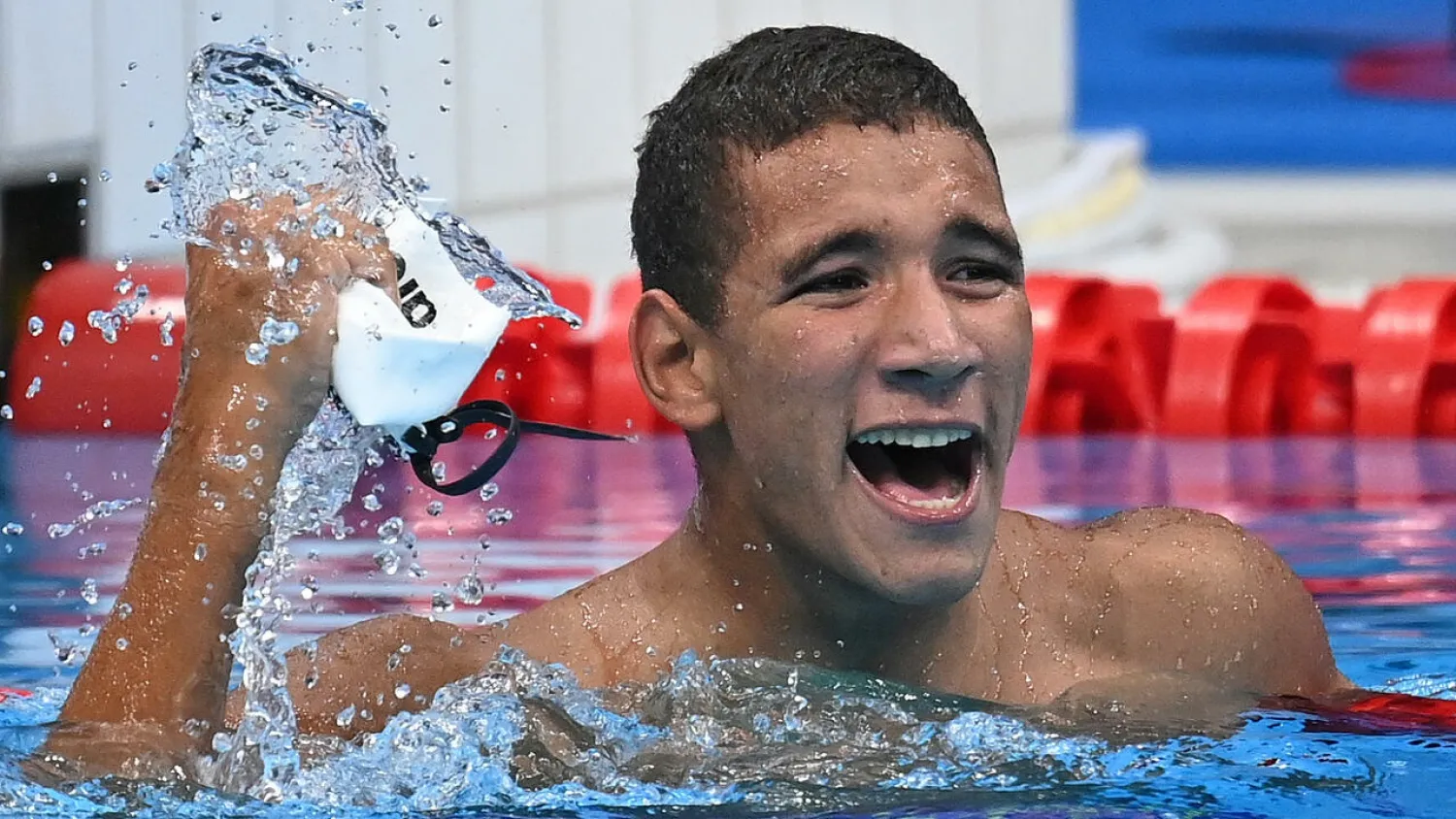 Michael Phelps hailed Ahmed Hafnaoui for his “unbelievable swim” on Sunday. (AFP)