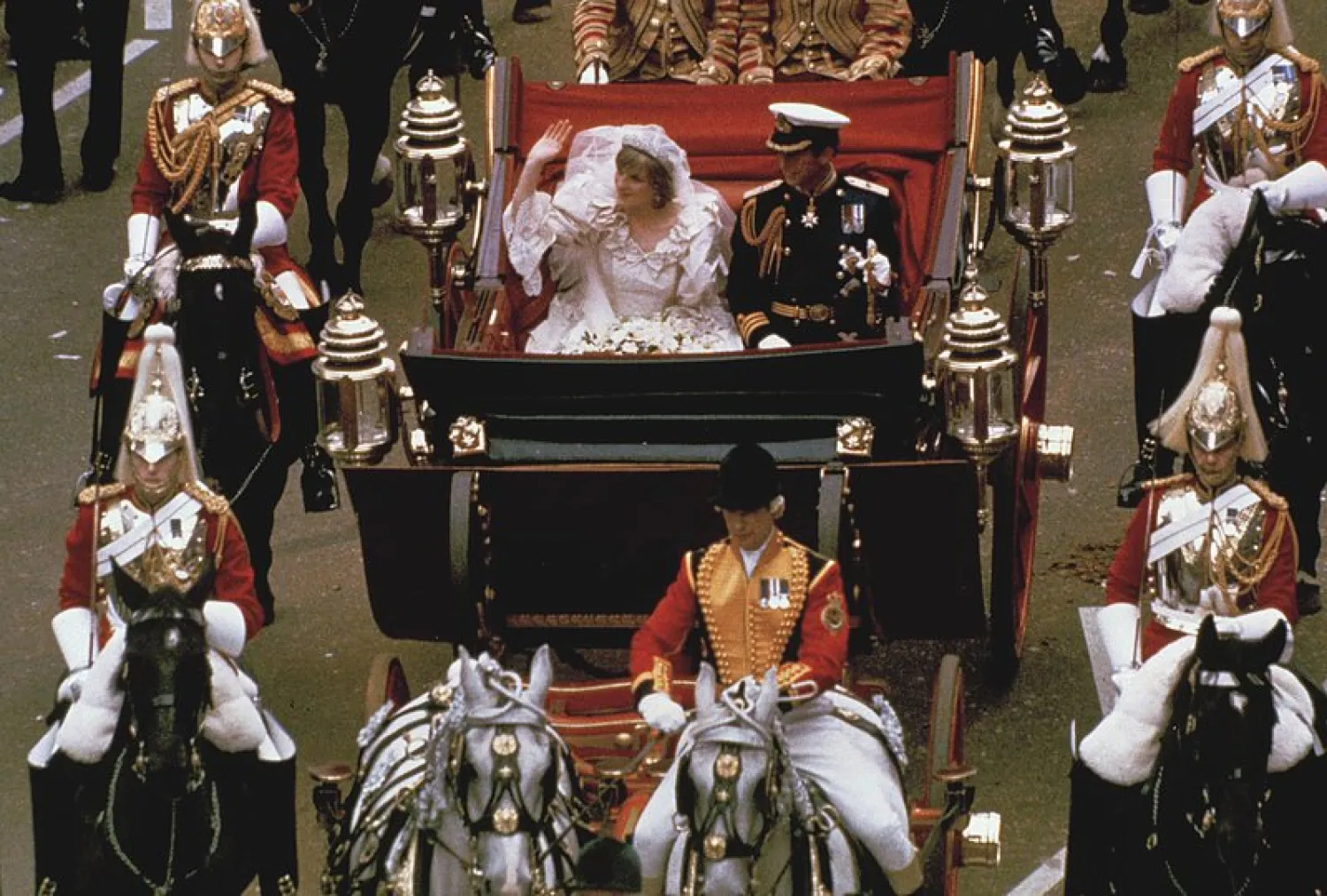 FILE - This is a July 29, 1981 file photo of the carriage carrying the Prince and Princess of Wales on its way from St. Paul's Cathedral to Buckingham Palace after the royal wedding in London. (AP Photo/File)
