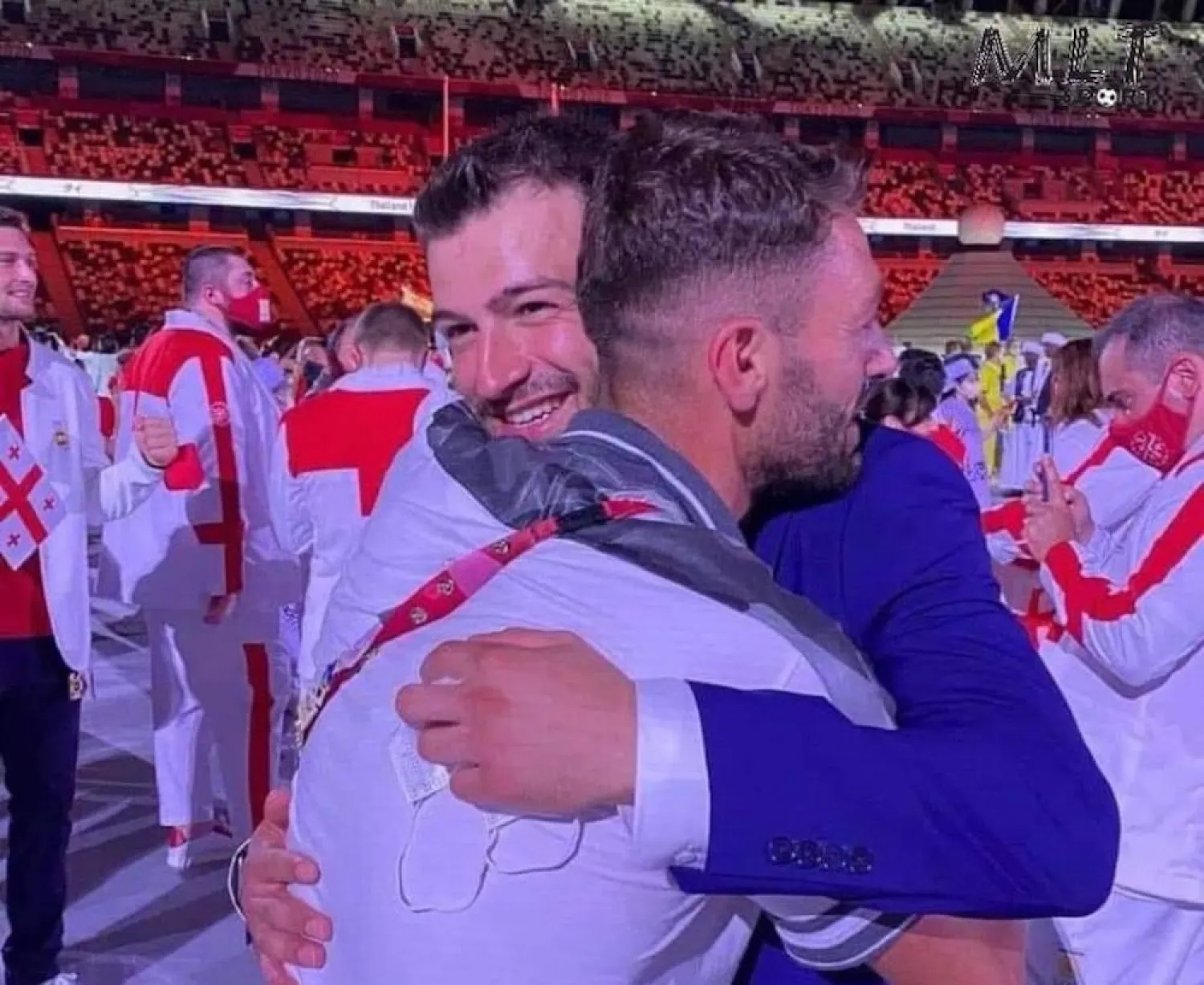 Alaa Maso from the Refugee Olympic Team — who is competing in the men’s swimming — was photographed embracing his brother Mohamad Maso, who is competing in the triathlon. (Screenshot)
