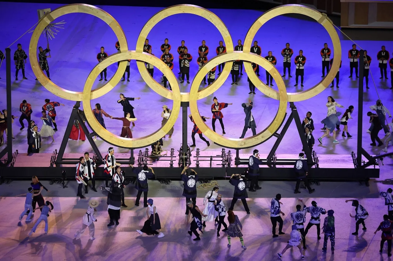 Performers are seen with the Olympics rings during the opening ceremony of the Tokyo 2020 Olympic Games, at the Olympic Stadium, in Tokyo, Japan, July 23, 2021. (Reuters)