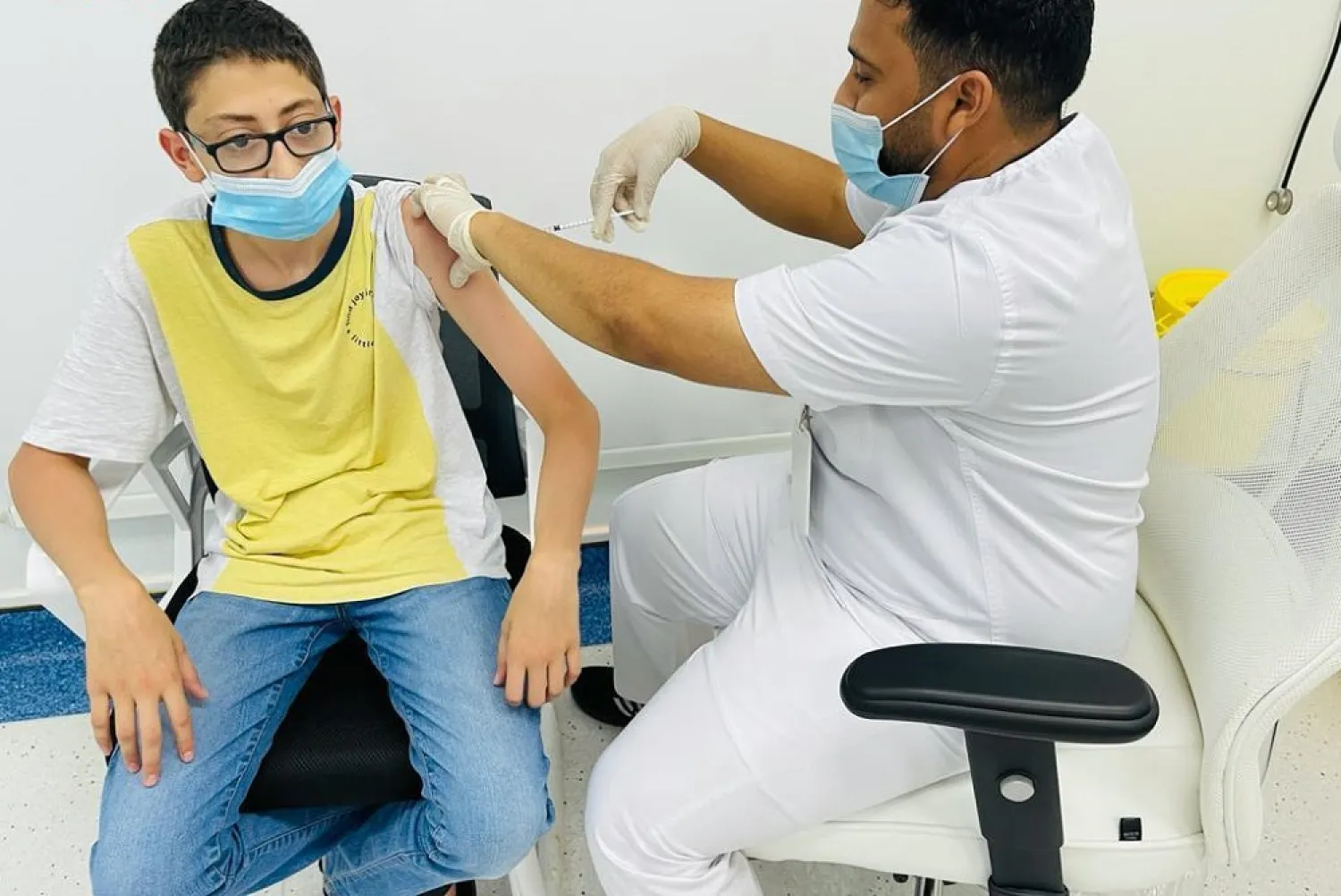 A boy receives a coronavirus vaccine shot in Saudi Arabia. (SPA)