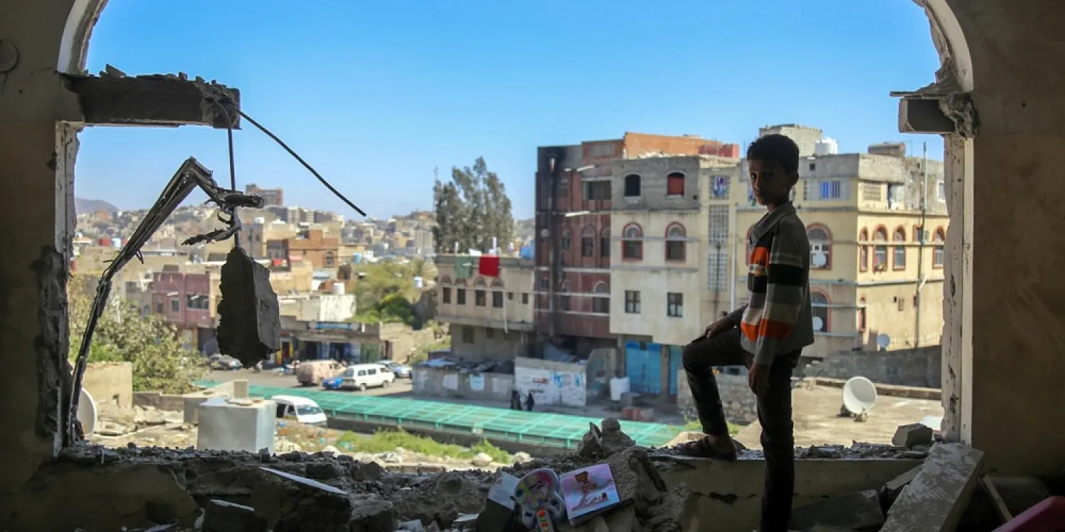 A Yemeni boy checks damage following a mortar attack in the city of Taiz, February 2016. (Getty Images)
