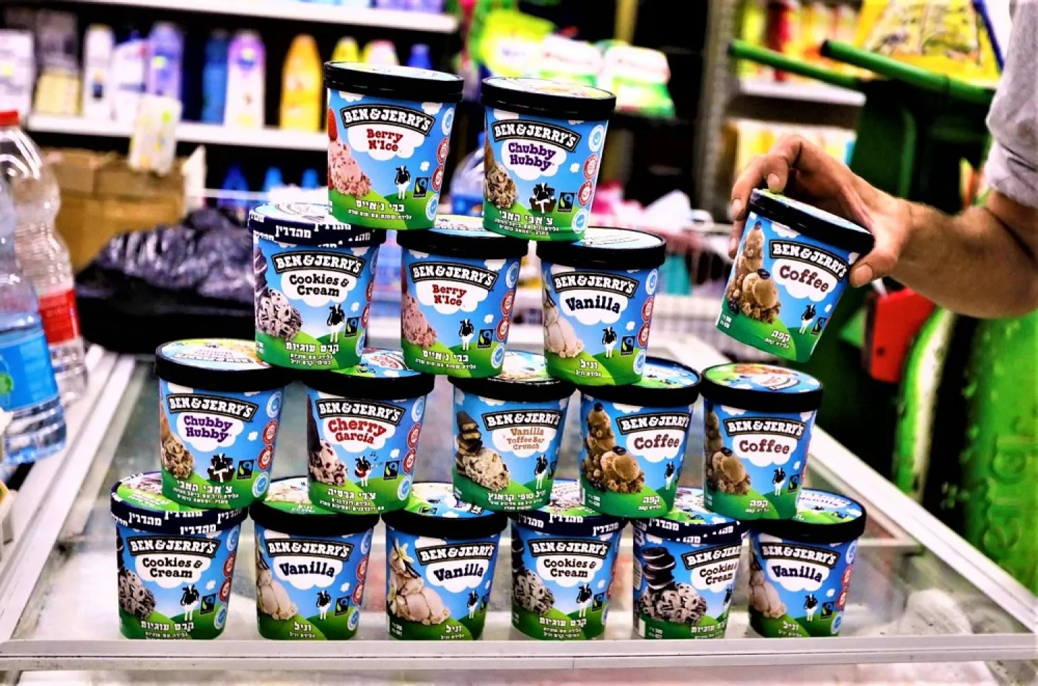A man picks up a tub of Ben & Jerry's ice cream in Jerusalem on July 20. (AFP)