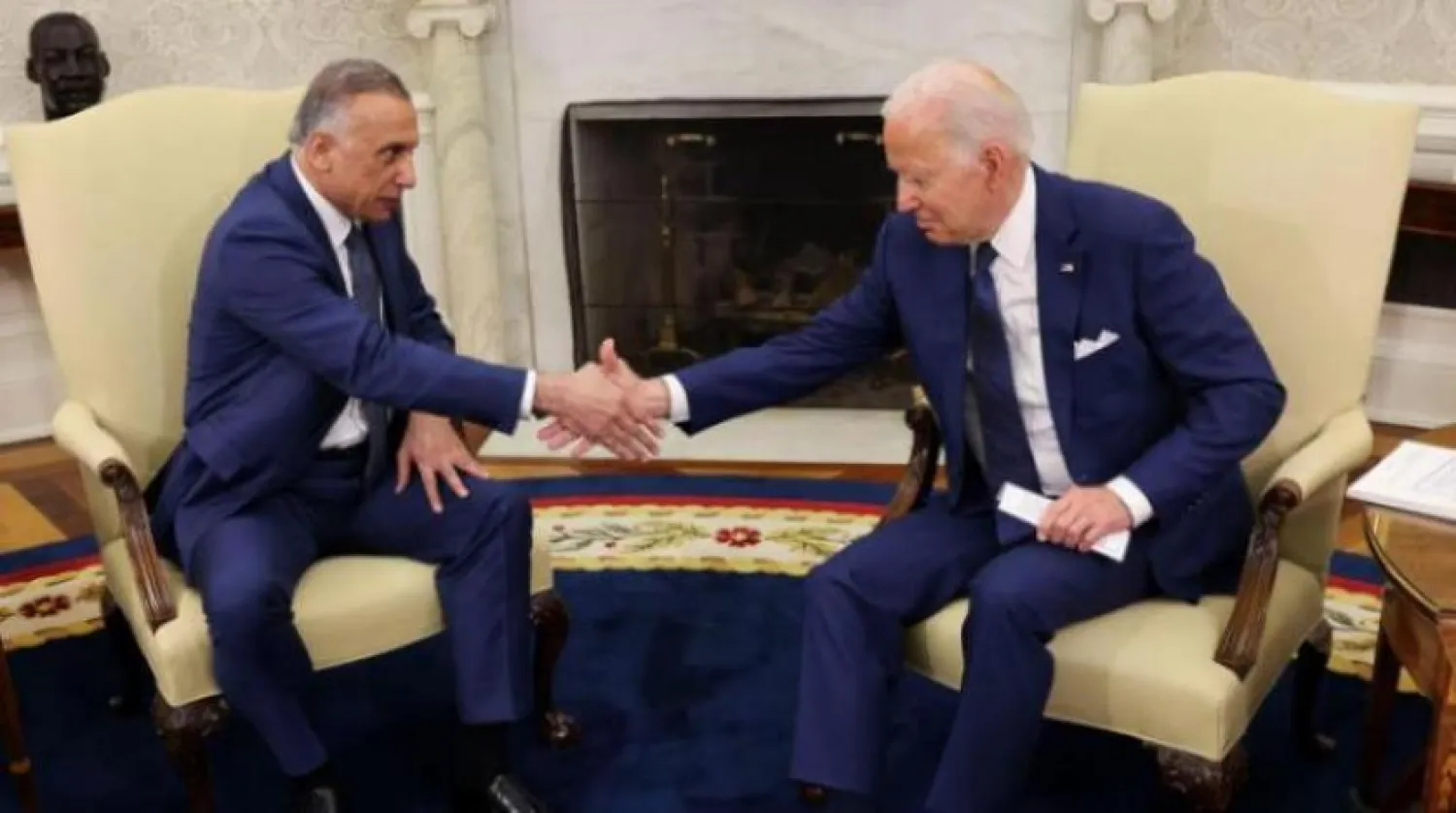 Iraqi Prime Minister Mustafa Al-Kadhimi and US President Joe Biden shake hands at the White House. Reuters 