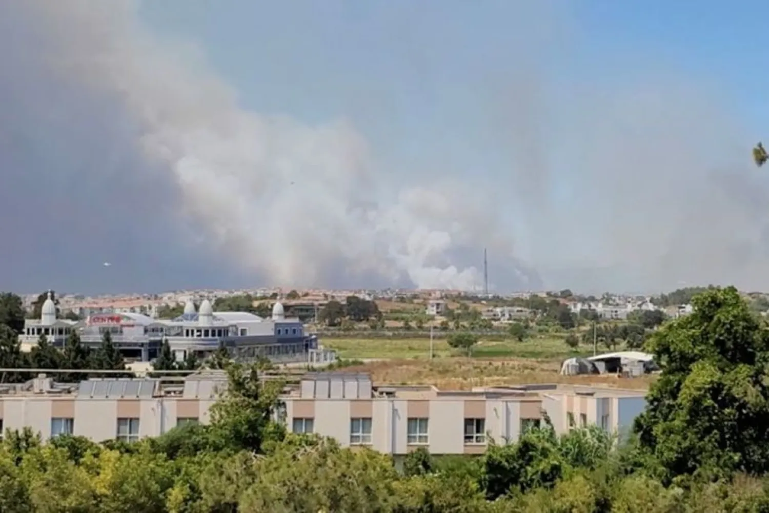 Smoke from a wildfire is seen in Manavgat, Antalya, Turkey July 28, 2021 in this still image taken from social media video. (Twitter/@Onurburakcelik/Via Reuters)