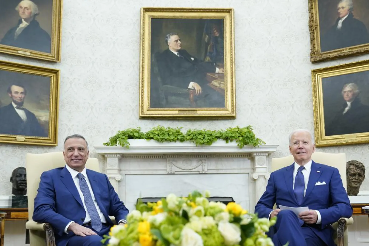 US President Joe Biden, right, meets with Iraqi Prime Minister Mustafa al-Kadhimi, left, in the Oval Office of the White House in Washington, Monday, July 26, 2021. (AP)