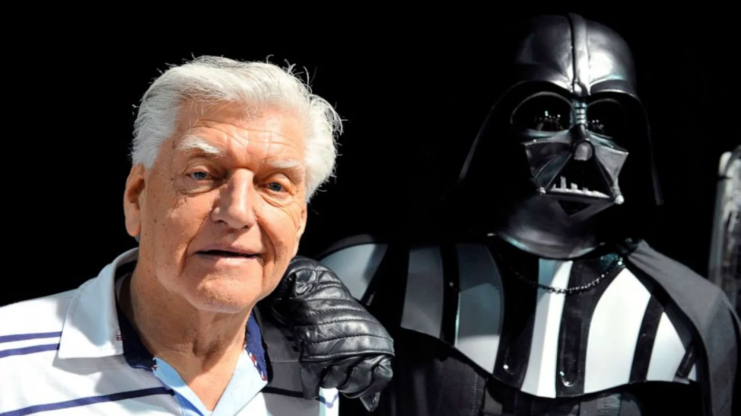 (FILES) This file photo taken on April 27, 2013 during a Star Wars convention in Cusset, central France, shows David Prowse, the British actor behind the menacing black mask of Star Wars villain Darth Vader, who died aged 85 his agent said on November 29, 2020.