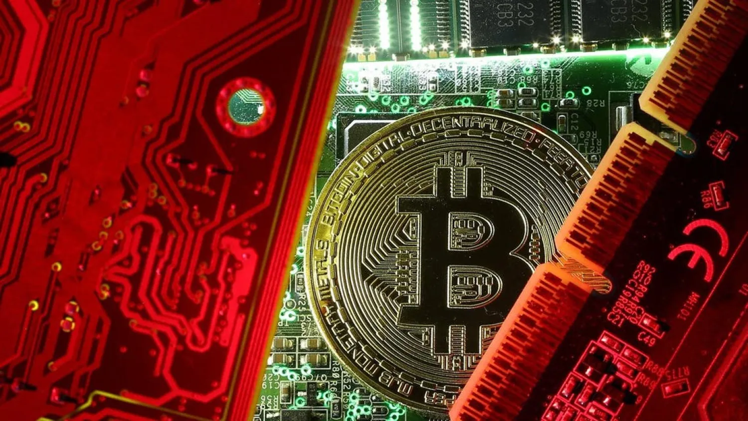 A coin representing the bitcoin cryptocurrency is seen on computer circuit boards in this illustration picture. (Reuters)