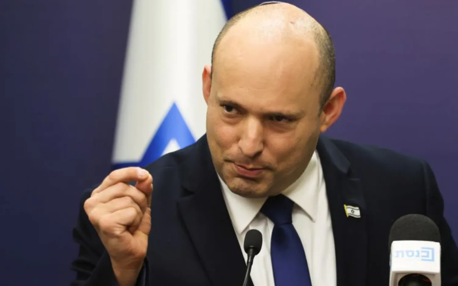 Israeli Prime Minister Naftali Bennett gestures as he speaks during his Yamina party faction meeting at the Knesset, Israel's parliament, in Jerusalem July 5, 2021. REUTERS/Ronen Zvulun