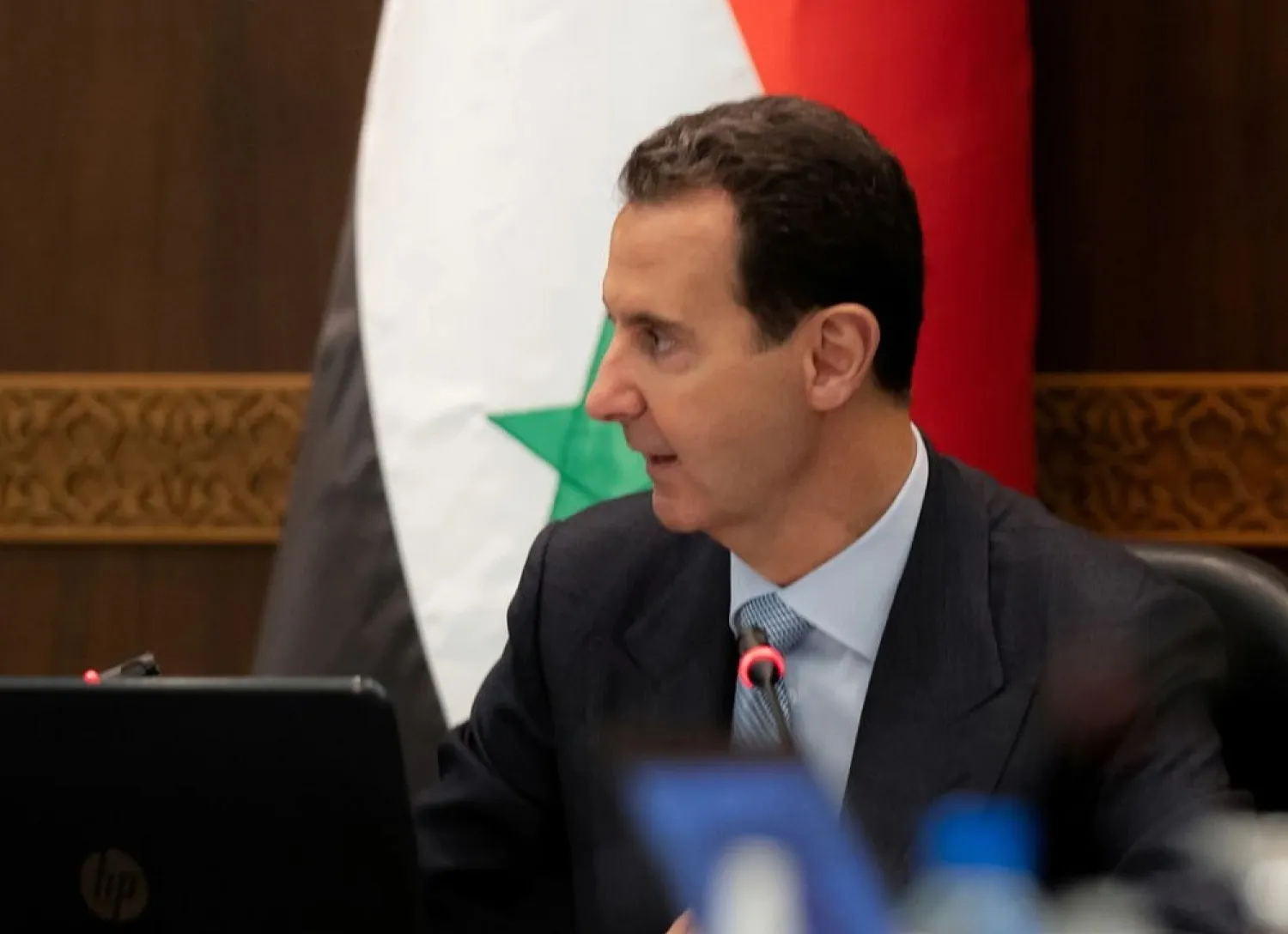 Syria’s President Bashar al-Assad speaks as he meets with the Syrian cabinet in Damascus, Syria in this handout picture released by Sana on March 30, 2021. (SANA Handout via Reuters)