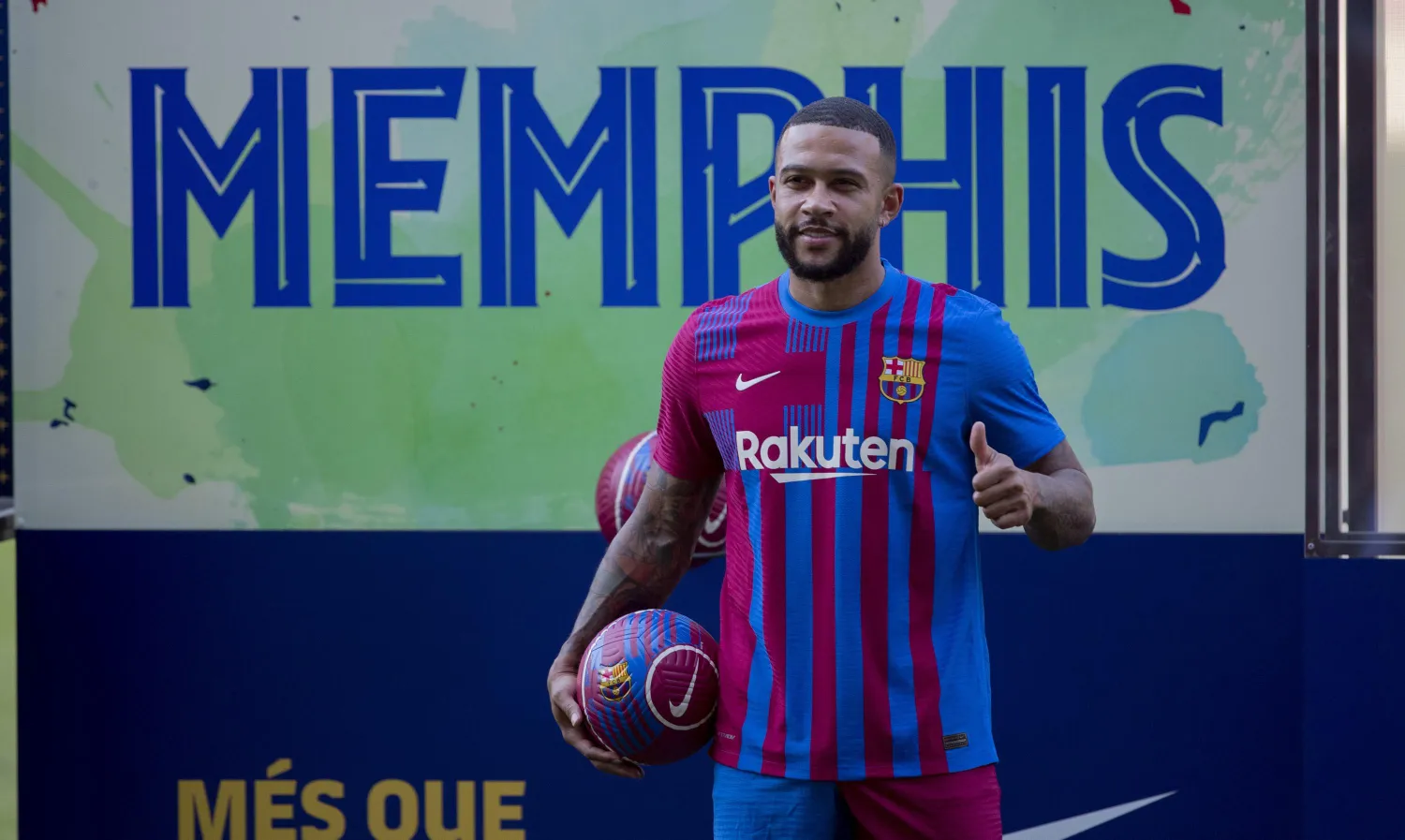 Netherlands striker Memphis Depay poses for the media during his official presentation after signing for FC Barcelona in Barcelona, Spain, Thursday July 22, 2021. Depay previously played for PSV Eindhoven, Manchester United and Lyon. (AP Photo/Joan Monfort)
