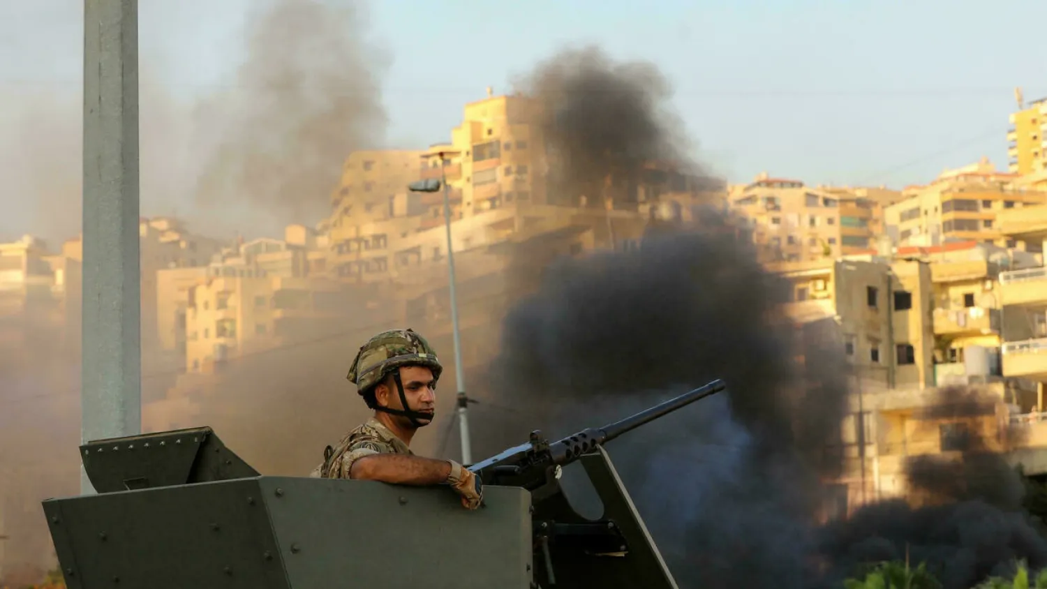 Military checkpoints backed by armored vehicles were erected at various road crossings leading to Khaldeh. (AFP)