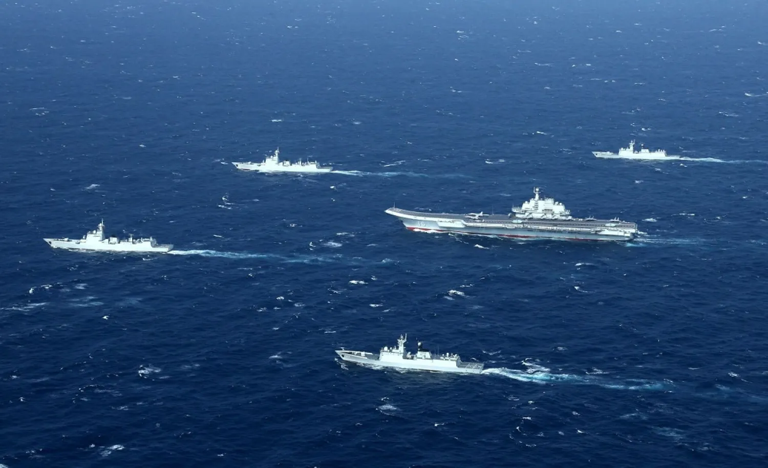 This aerial photo taken on January 2, 2017 shows a Chinese navy formation, including the aircraft carrier Liaoning (C), during military drills in the South China Sea. (AFP)