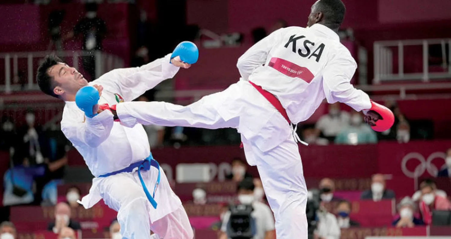 ركلة حامدي لمنافسه الإيراني التي أثارت الكثير من الجدل في أولمبياد طوكيو (أ.ب)
