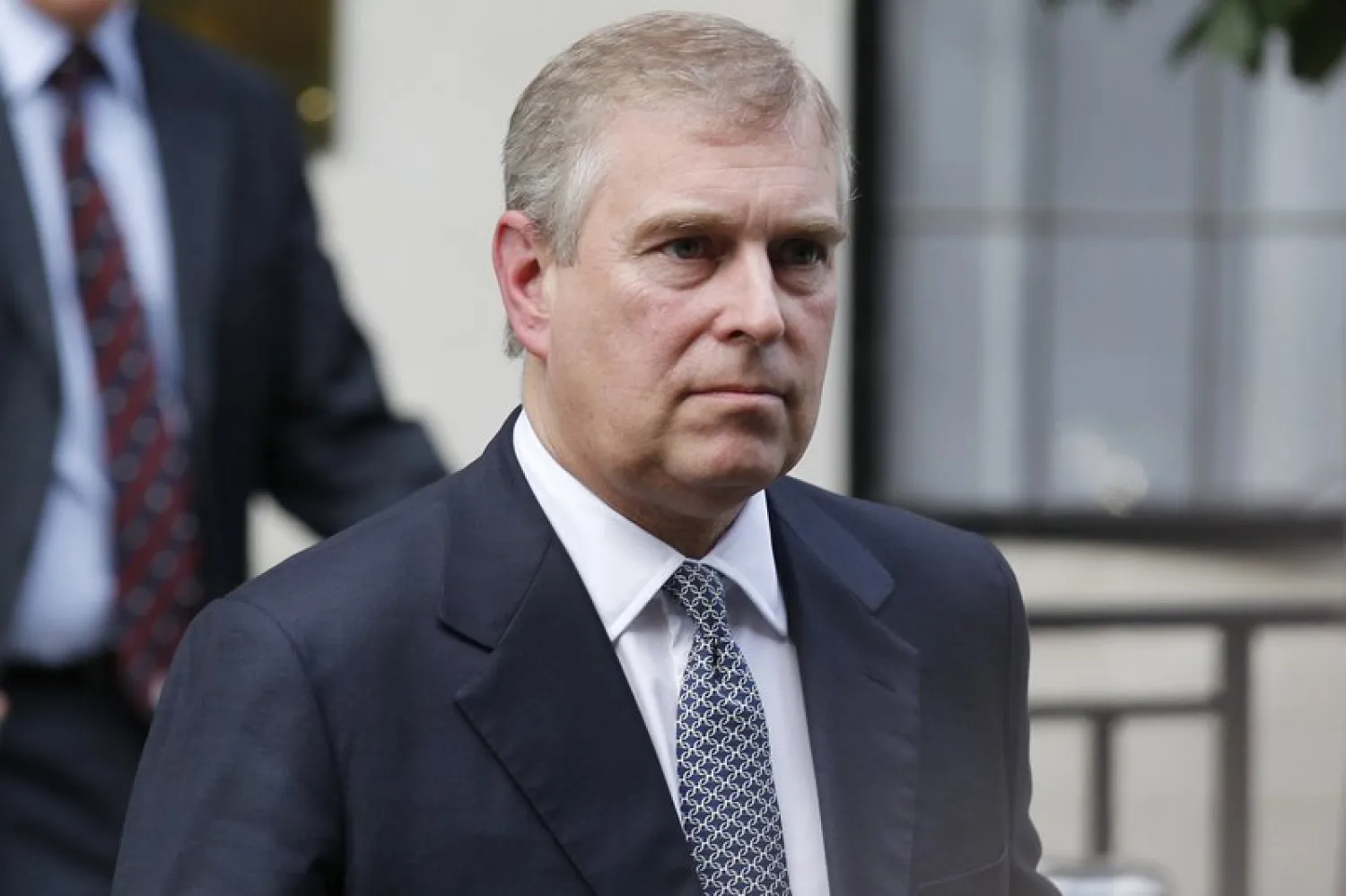 FILE- In this June 6, 2012 file photo, Britain's Prince Andrew leaves King Edward VII hospital in London after visiting his father Prince Philip. (AP Photo/Sang Tan, File)
