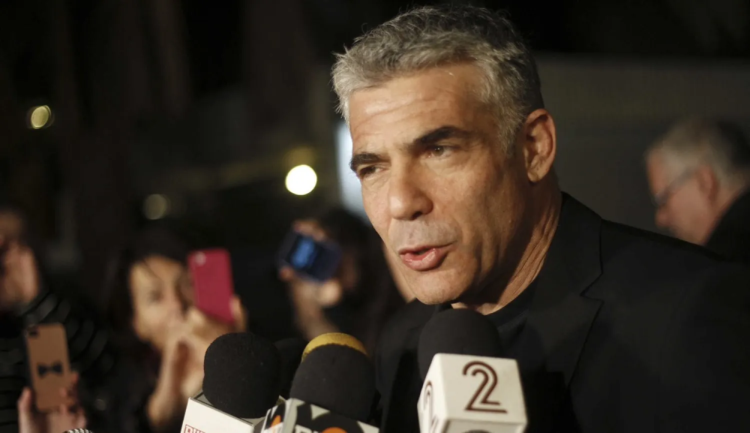 Yair Lapid will head of a delegation of lawmakers and officials who will meet with Moroccan officials and inaugurate the Israeli Liaison Office in Rabat. (AP)