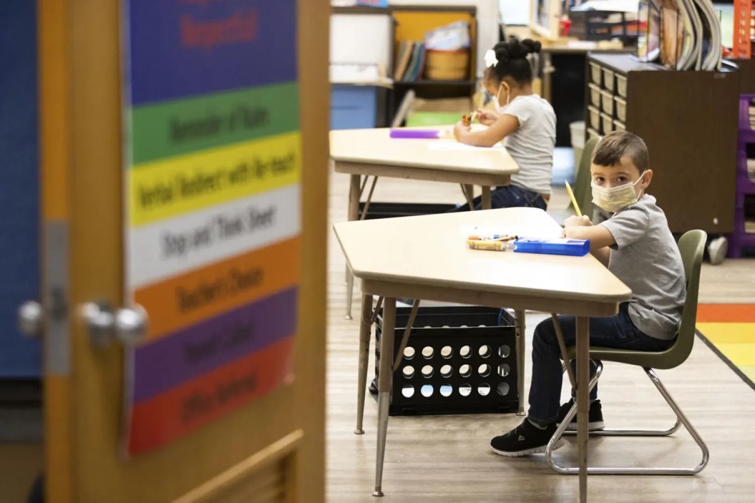 FILE - In this Aug. 27, 2020, file photo, first grade students at Dunmore Elementary Center in Dunmore, Pa., wear face masks on their first day of classes. (Christopher Dolan/The Times-Tribune via AP)
