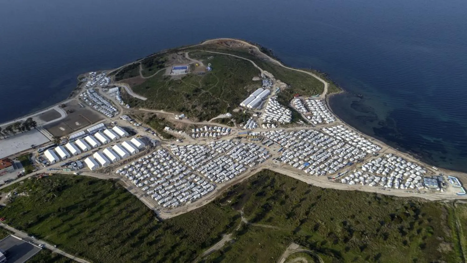 FILE - In this file photo dated Monday, March 29, 2021, a general view from above Karatepe refugee camp, on the eastern Aegean island of Lesbos, Greece. (AP Photo/Panagiotis Balaskas, FILE)
