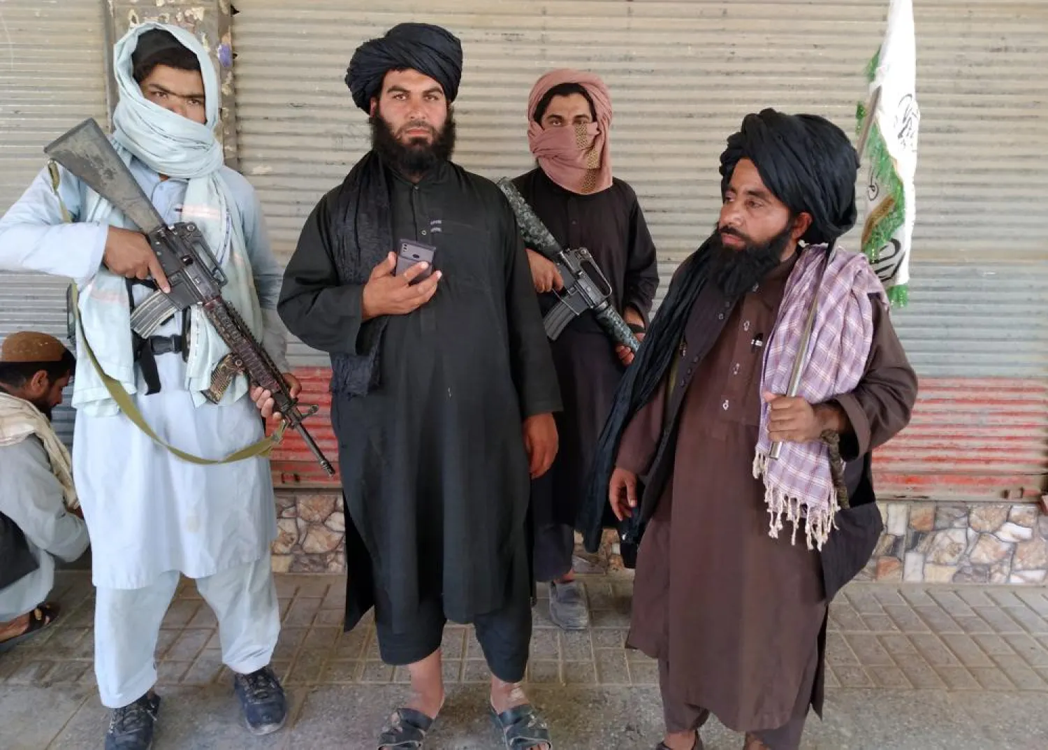Taliban militants patrol inside the city of Farah, the capital of Farah province, southwest of Kabul, Afghanistan, Wednesday, Aug. 11, 2021. (AP Photo/Mohammad Asif Khan)

