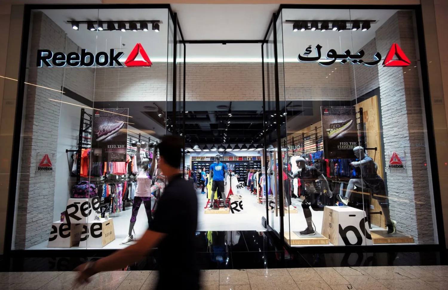 A man walks in front of the Reebok store at Bahrain City Center in Manama, Bahrain September 17, 2017. (Reuters)