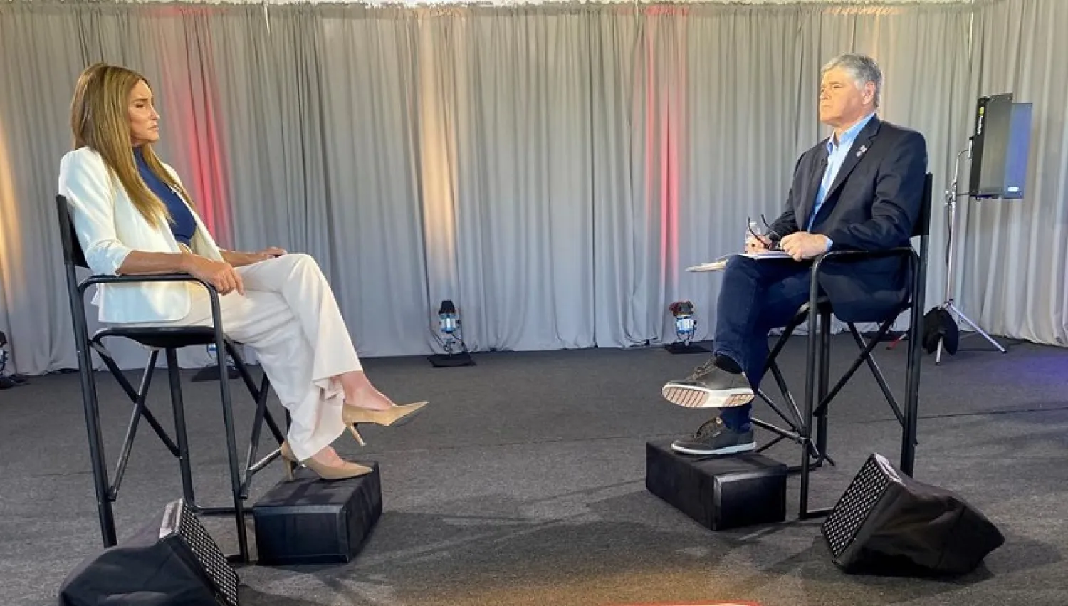 In this image provided by Fox News Channel, Caitlyn Jenner is interviewed by Fox News host Sean Hannity, Wednesday, May 5, 2021, in Malibu, Calif. (Fox News Channel via AP)
