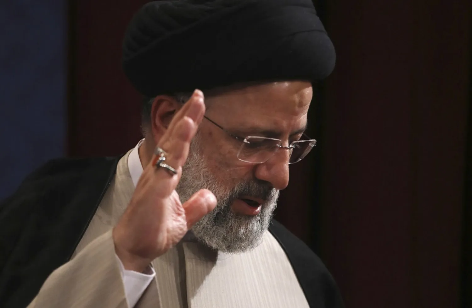 Iran's new President-elect Ebrahim Raisi waves at the conclusion of his news conference in Tehran, Iran, June 21, 2021. (AP)