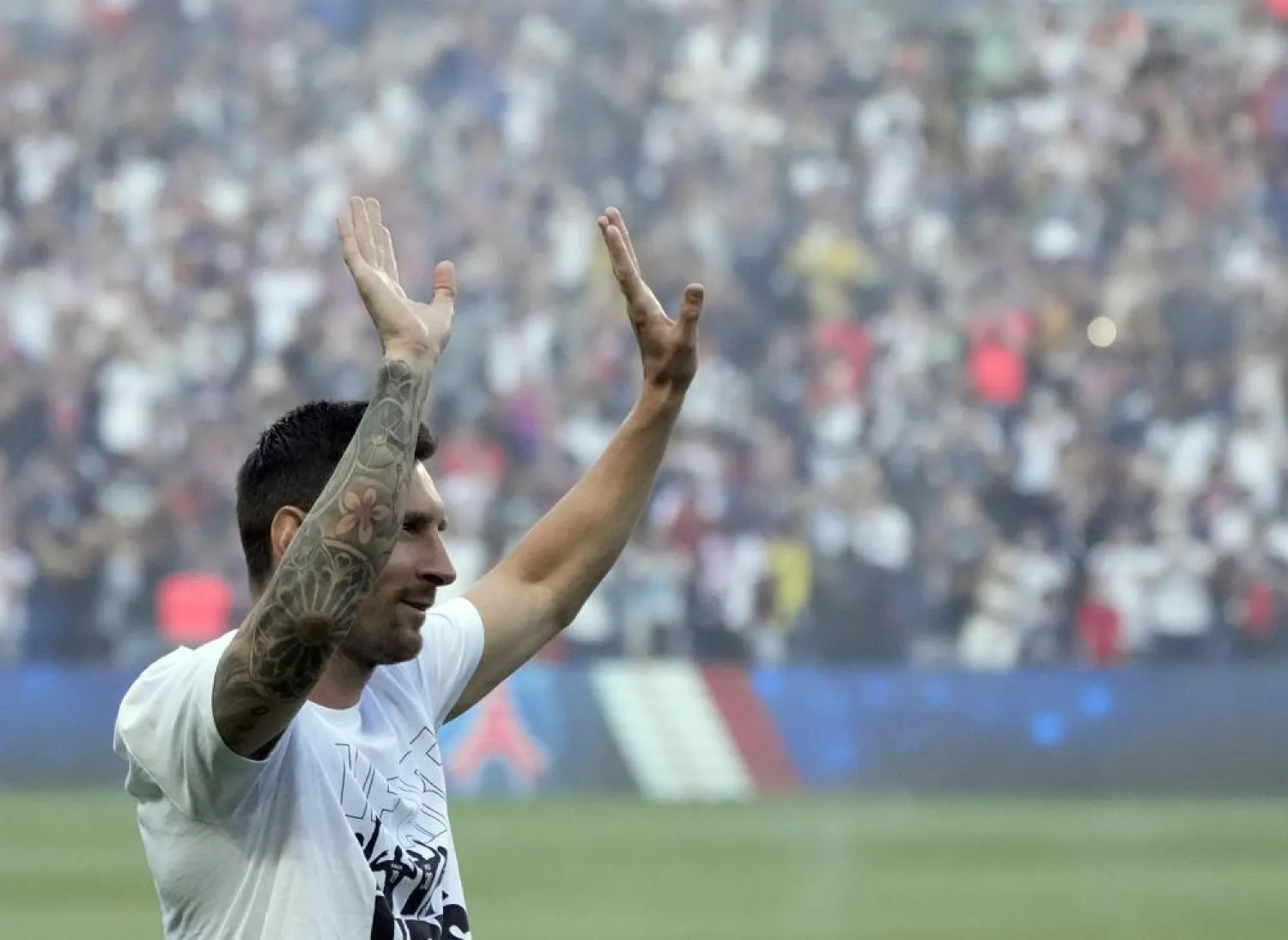 PSG's Lionel Messi waves during players presentation before the French League One match between Paris Saint Germain and Strasbourg, at the Parc des Princes stadium in Paris, Saturday, Aug. 14, 2021. (AP)