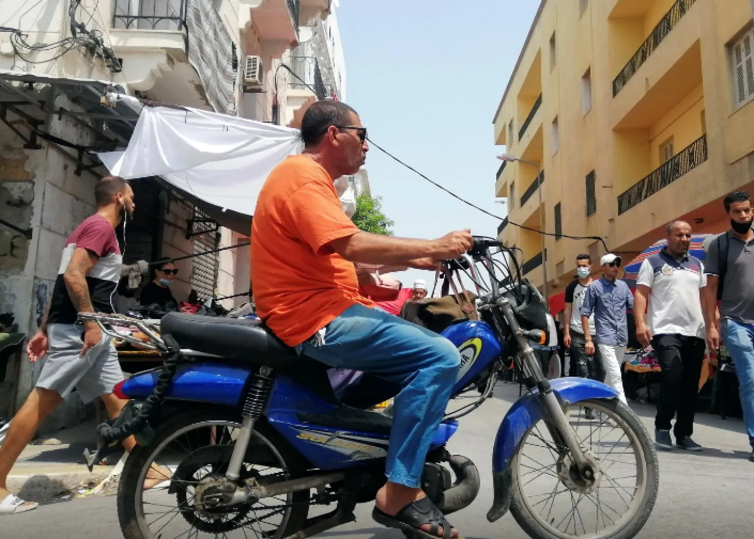A man rides a motorbike in Tunis, Tunisia August 12, 2021. REUTERS/Jihed Abidellaoui