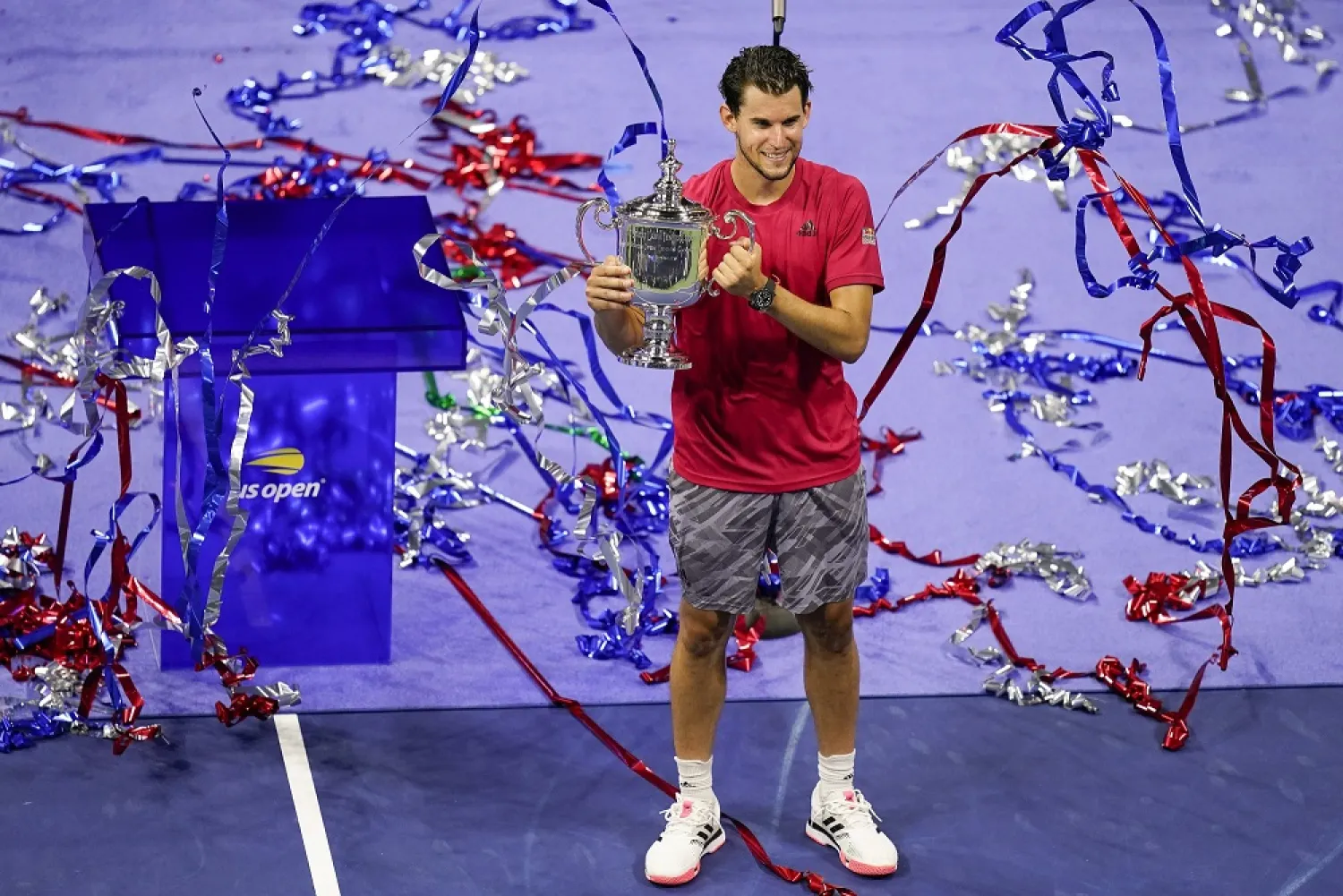 Confetti falls as Dominic Thiem holds up the championship trophy, in New York, United States, Sept. 13, 2020. (AP)