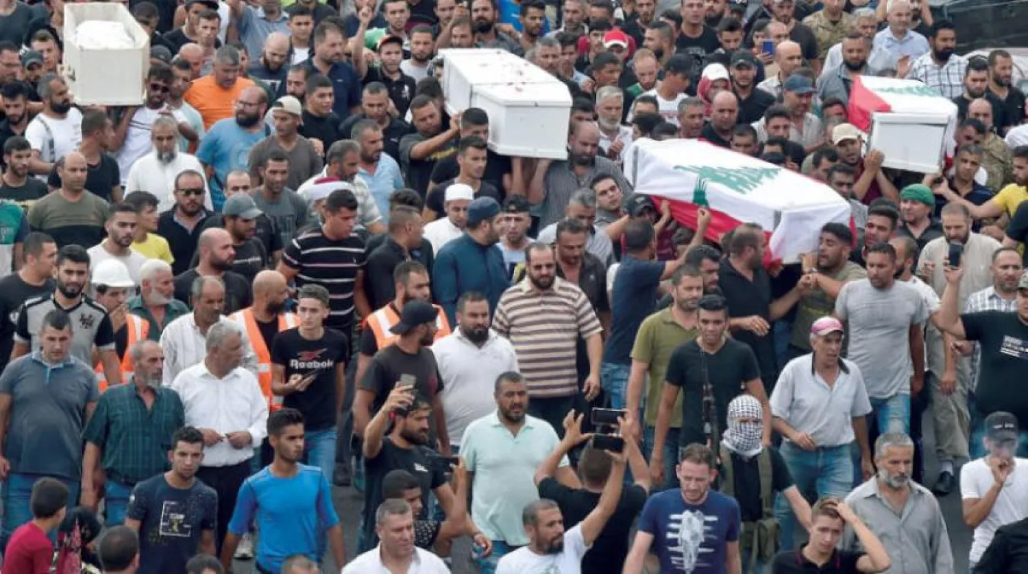 18 Ağustos’ta, Akkar’daki kaçak benzin deposunda meydana gelen patlamanın 4 kurbanının cenazesi (EPA)