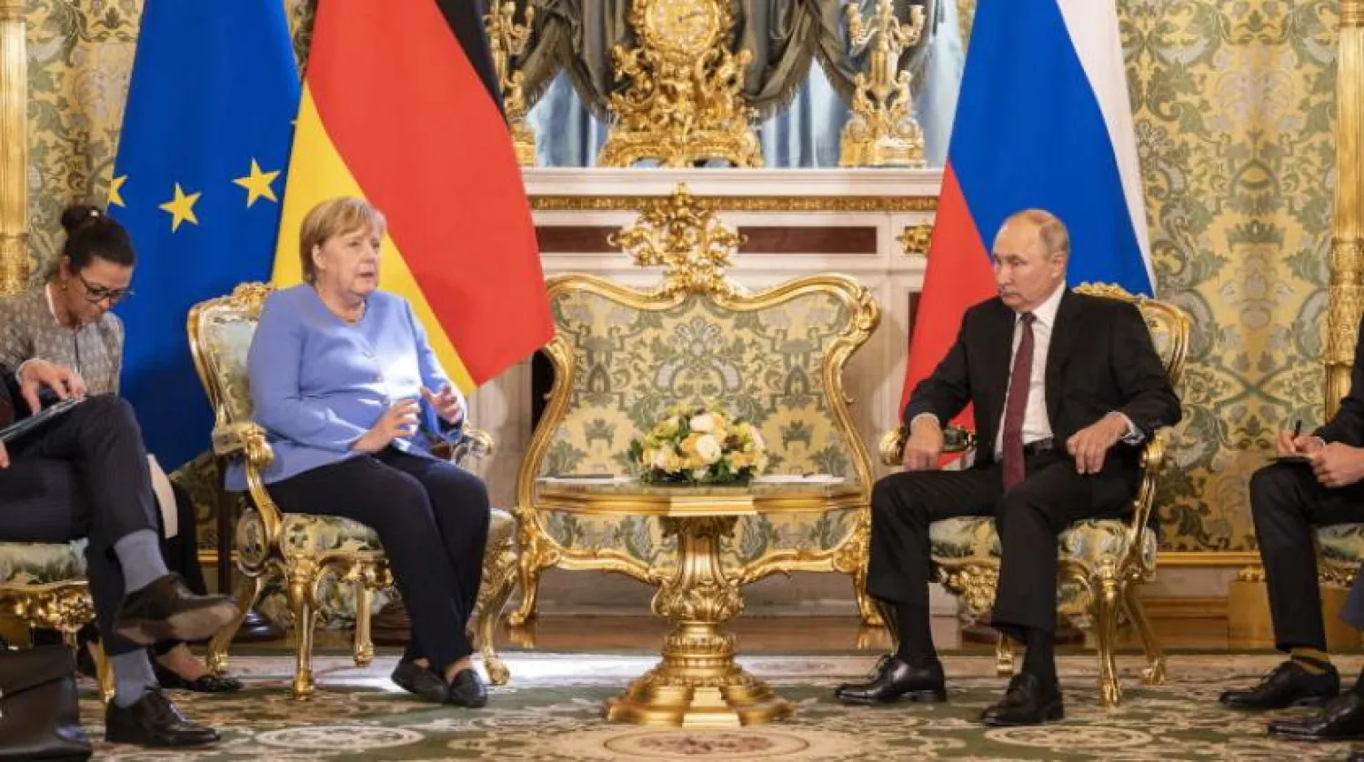 Rusya Devlet Başkanı Vladimir Putin ve Almanya Başbakanı Angela Merkel Kremlin’de (EPA)